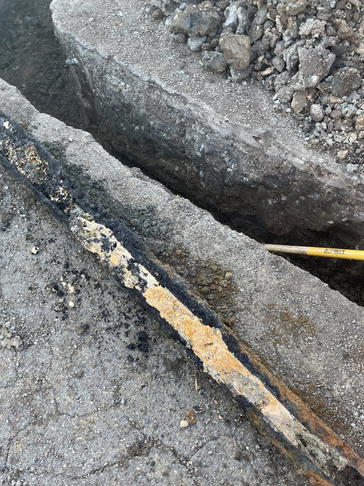 Sewer line excavation and pipe repair